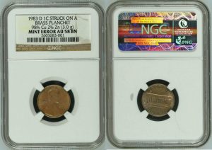 1 1983 cent struck on brass planchete.jpg
