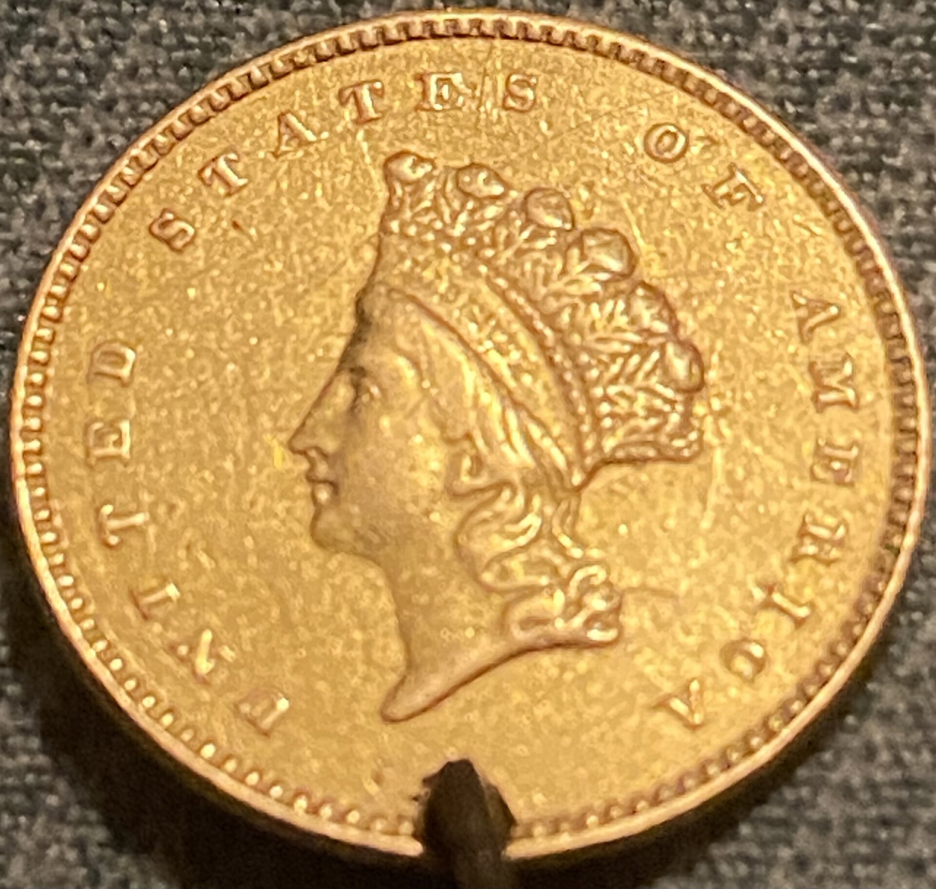 1854 Damaged Gold Dollar.jpeg