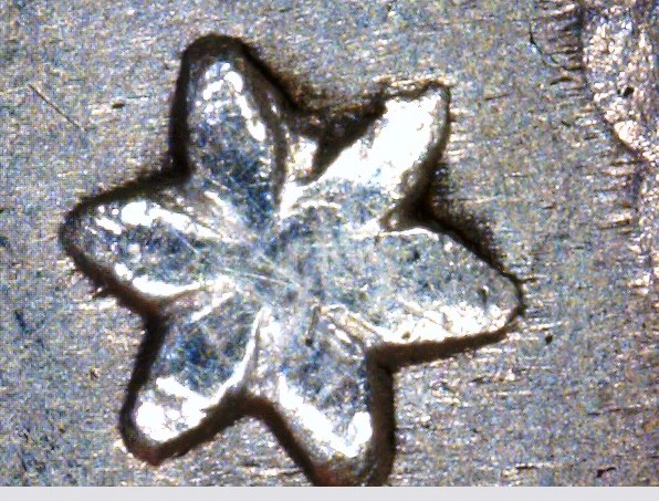 1857 seated half dime star.jpg