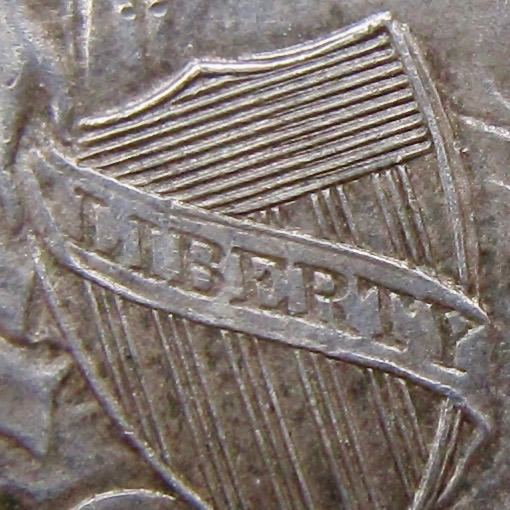 1861 seated dollar SHIELD close-up - 1.jpg