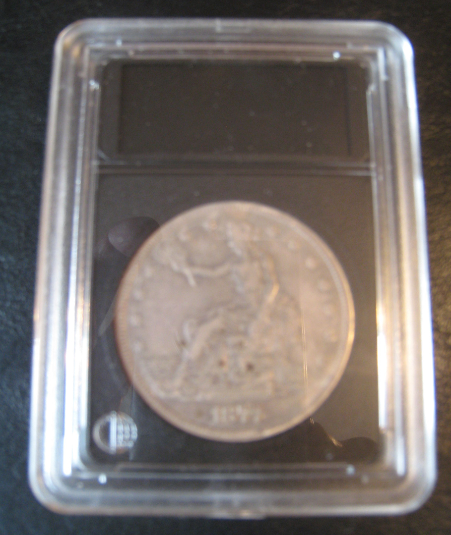 1877-OTradeDollarInCase.jpg