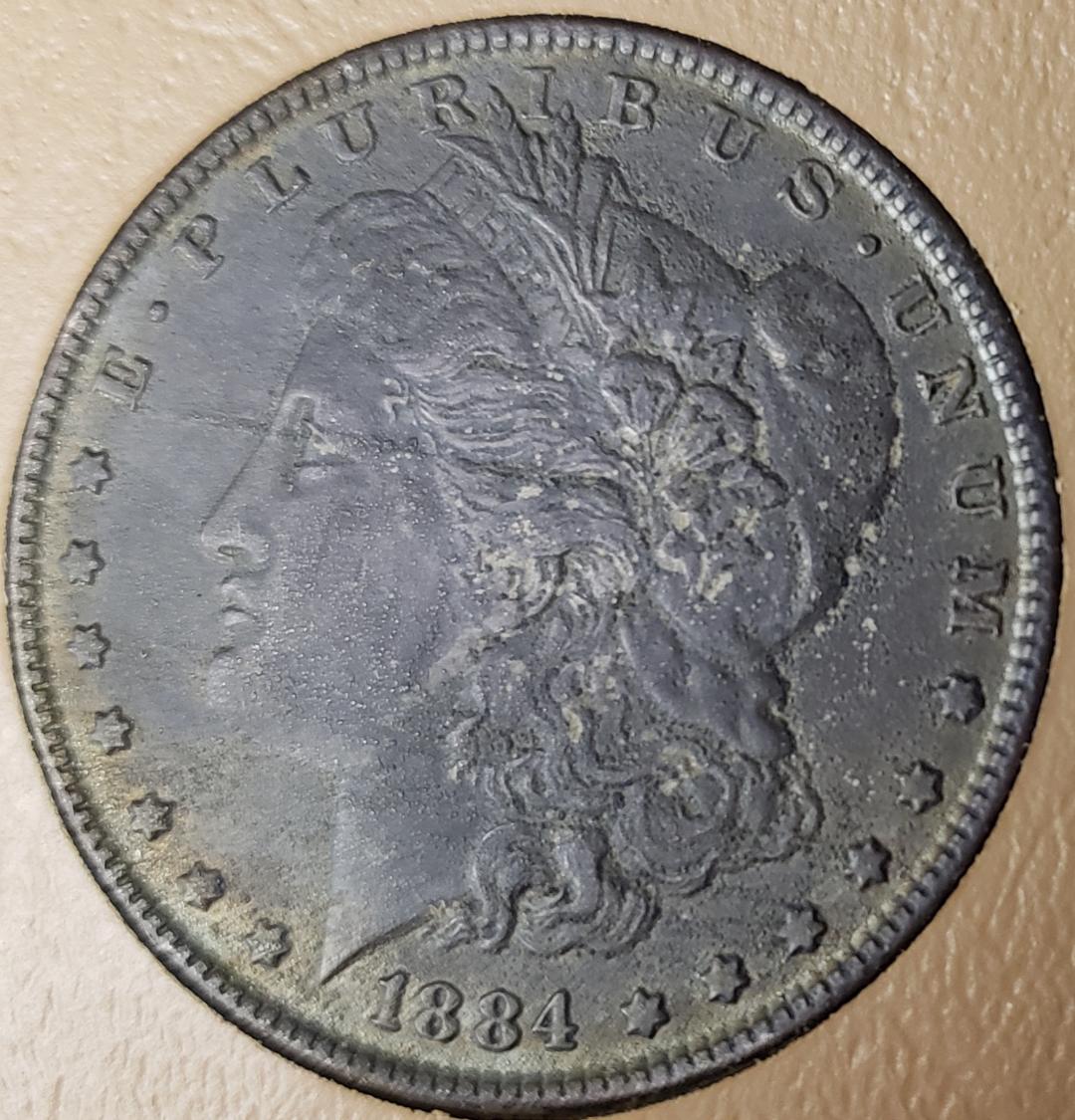 1884 Morgan Dollar heavy carbon rev.jpg