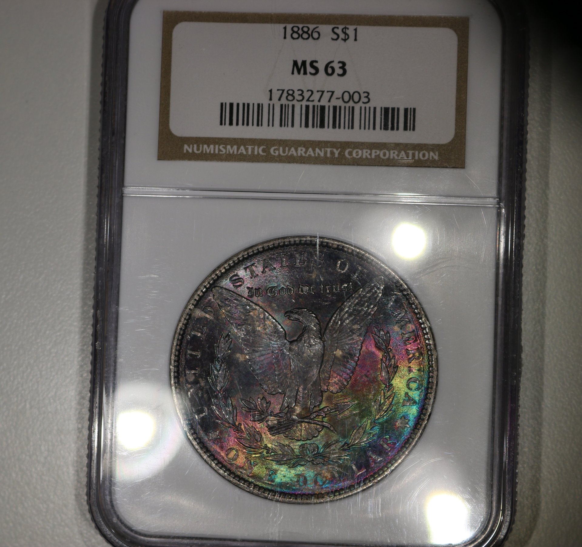 1886 MS63 Morgan Rainbow Toned.jpg