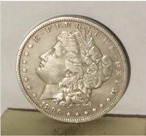 1896 O morgan silver dollar head.PNG