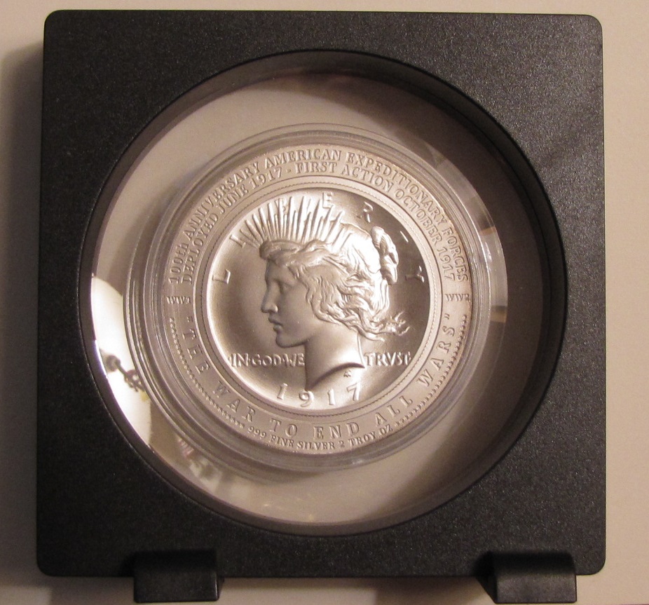 1917 2 oz. Peace token in holder.JPG