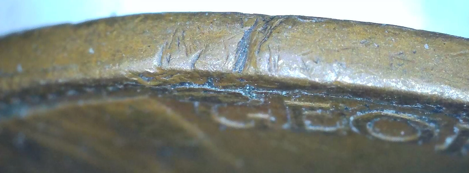 1921_canada_cent_rim_lamination.jpg