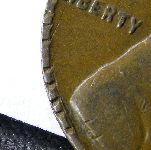 1940 S Lincoln Wheat Penny (Close Up Notches).jpg
