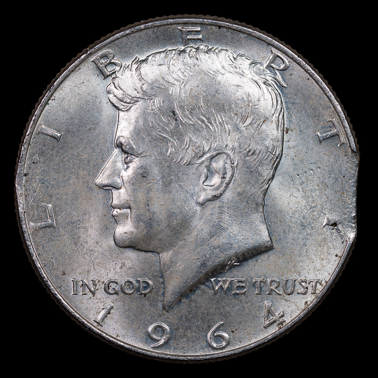1964-Kennedy-Half-Dollar-Clipped-Planchet-Obverse.jpg