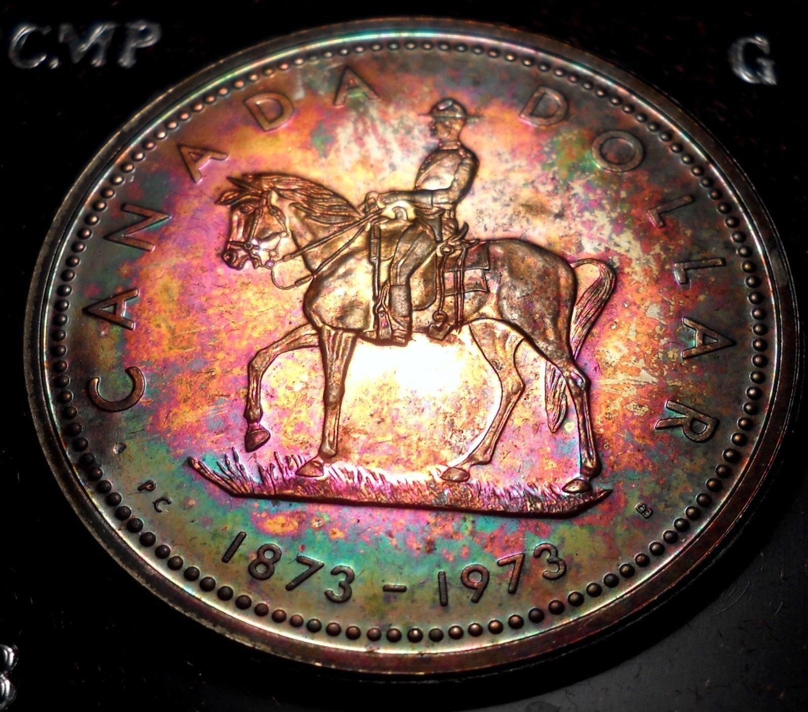 1973 Canada Stunning Rainbow Silver Dollar with Clamshell Case.jpg