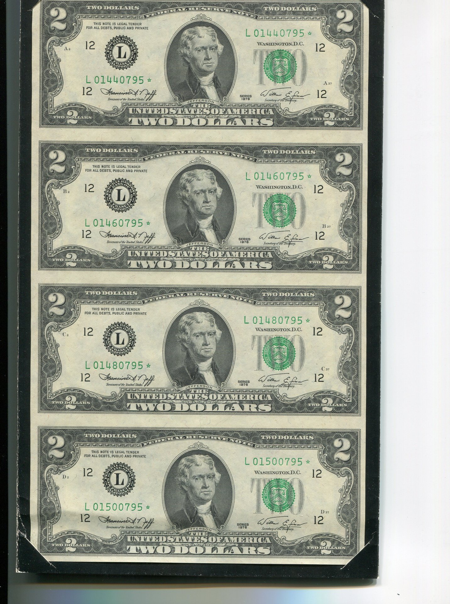 2 dollar bills uncut.jpg