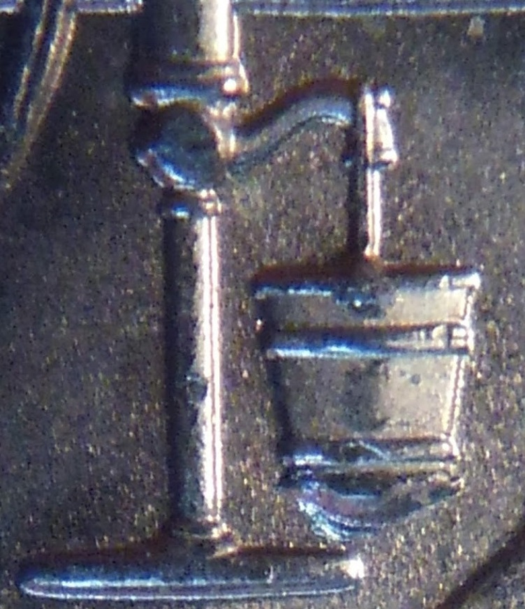 2015PNebraskaHomestead25c-LeakyBucketDieChip-Close4-VNice.JPG