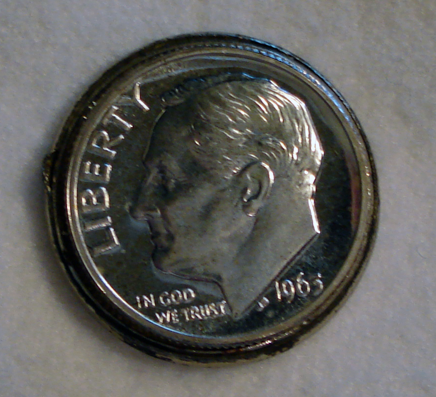4 Roosevelt Silver Dime Nestled into Obverse of 1958-D Lincoln Wheat Cent.jpg