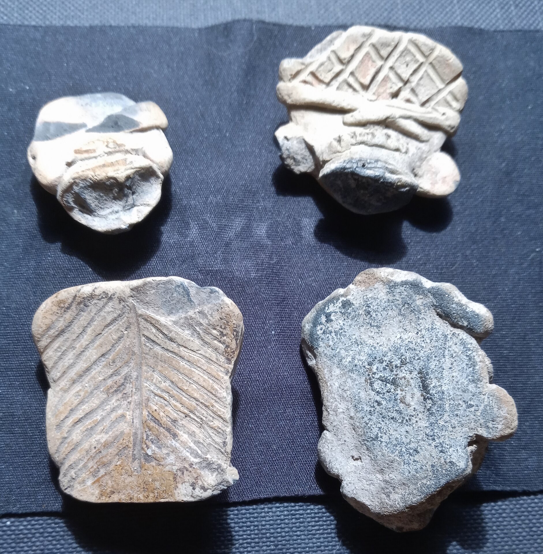 4 small Mexican pre-Columbian heads back.jpg
