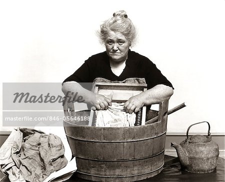 846-05646188em-1920s---1930s---1940s-SENIOR-WOMAN-WASHING-CLOTHES-IN-OLD-FASHIONED-WO.jpg