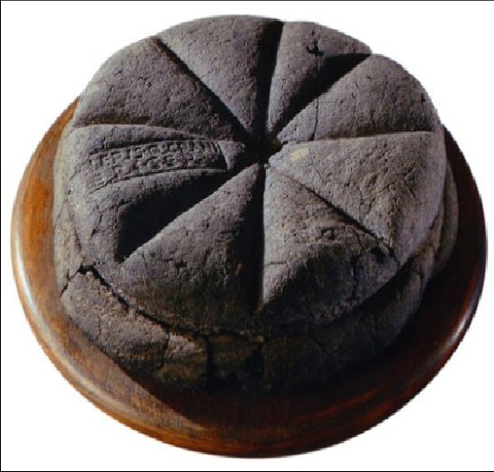 A-stamped-loaf-of-bread-from-Pompeii-dated-to-the-first-century-AD-the-stamp-bears-the.png