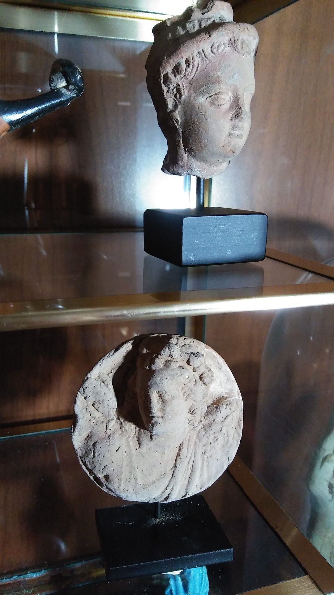 Antiquities - terracotta head of boy & roundel.jpg