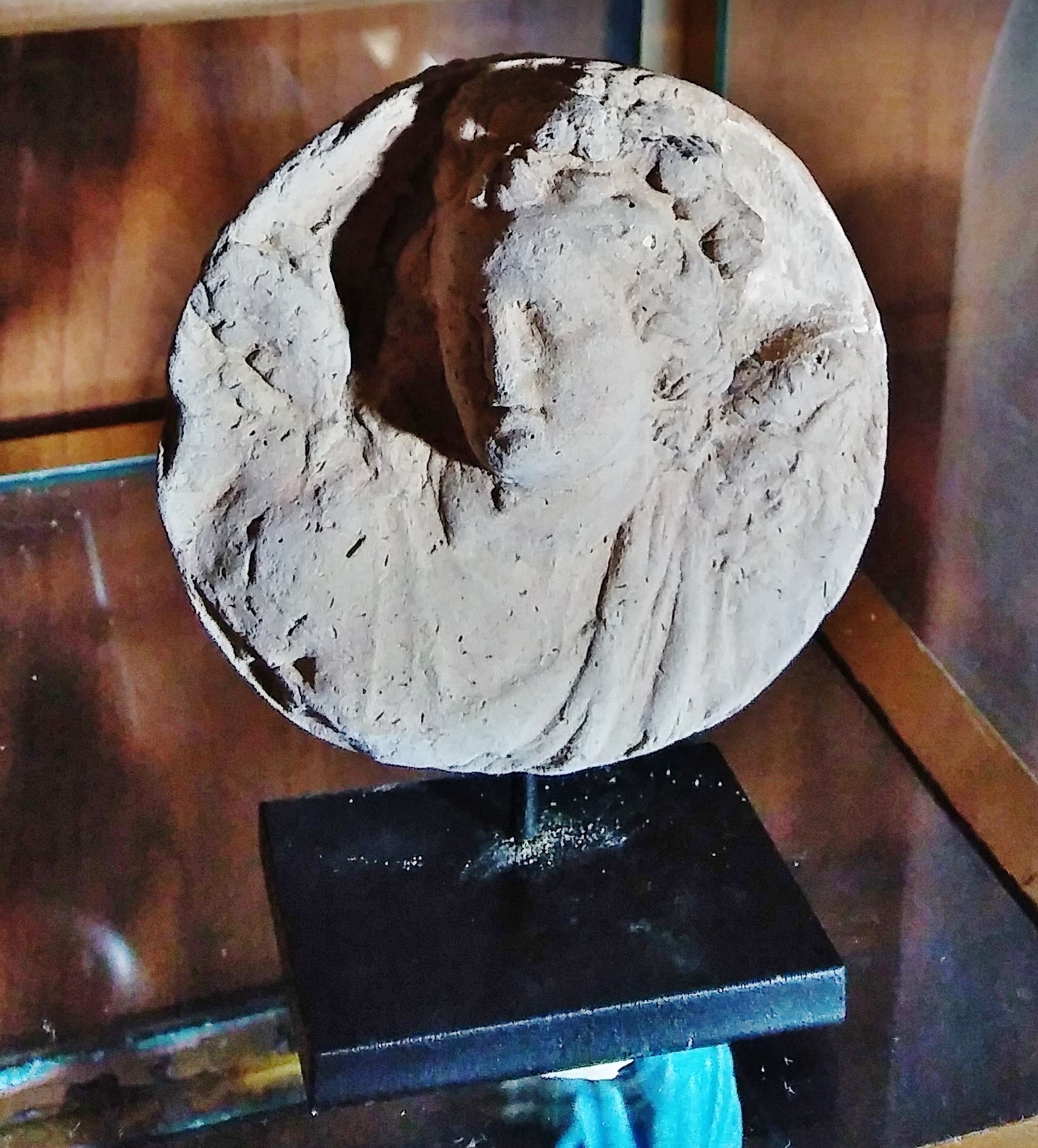 Antiquities - terracotta head of boy & roundel.jpg