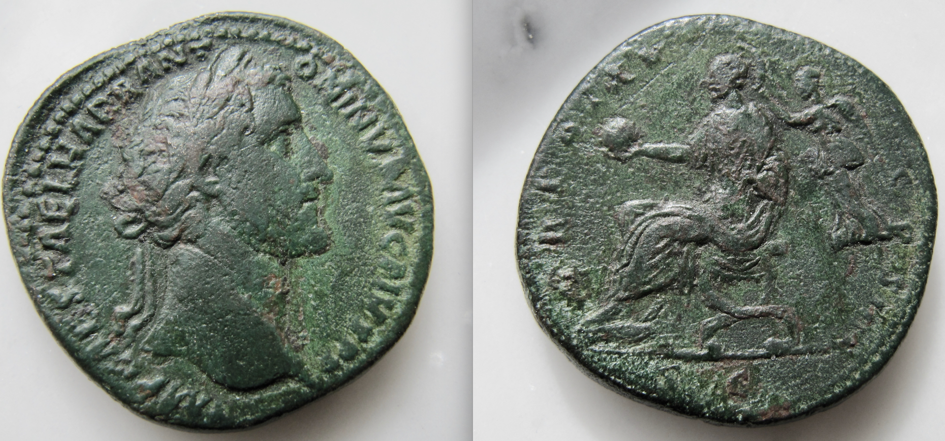 Antoninus Pius Sestertius - Emperor sits with Globe, Victoria behind - OBV:REV - GP .png