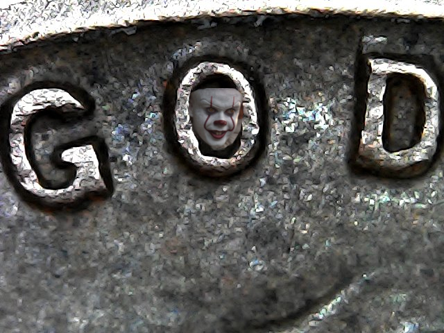 Clown face inside the letter O in a 1958 Lincoln cent.jpg