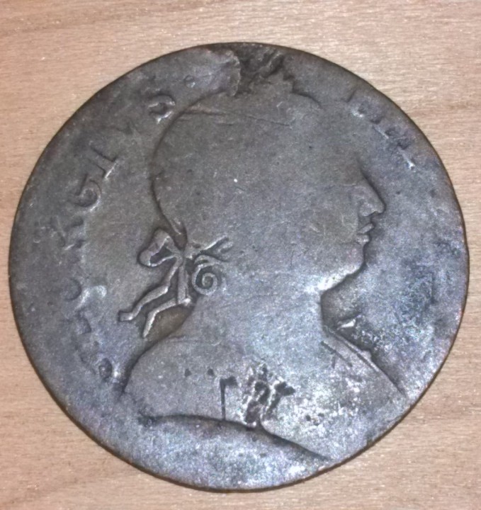 counterfeit british half pence cropped.jpg