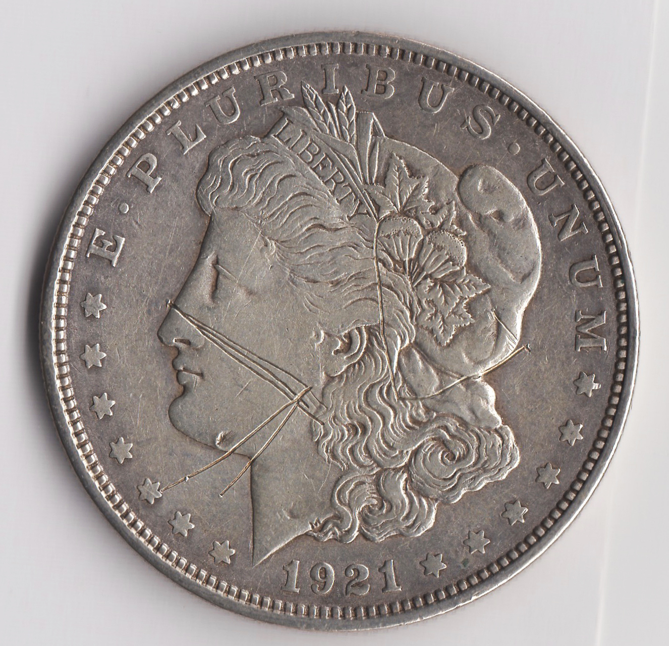 damage on 1921-d Morgan-why GPI keep? copy.jpg