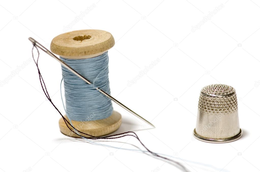 depositphotos_1753070-stock-photo-spool-of-thread-with-needle.jpg