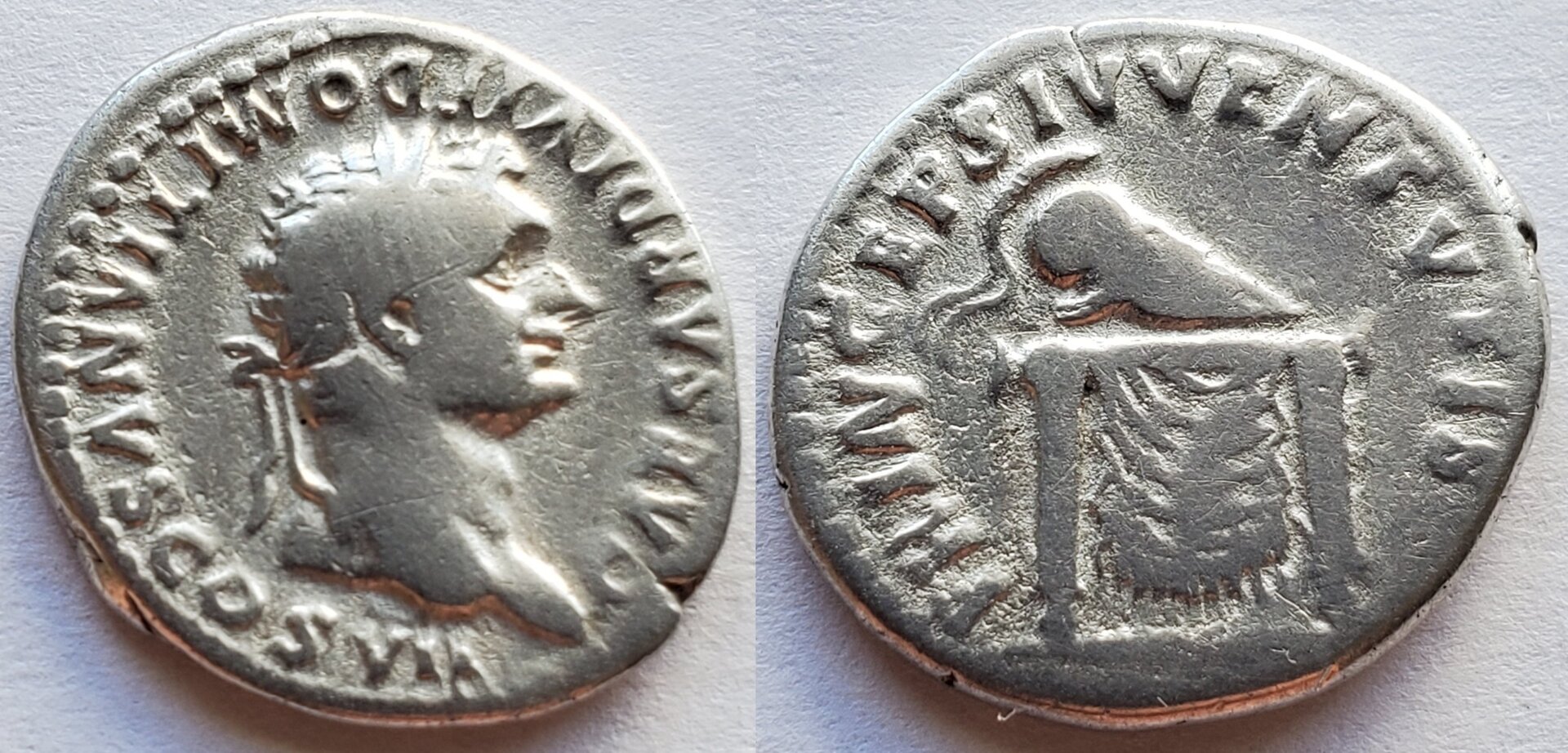 Domitian caesar under titus helmet on table.jpg