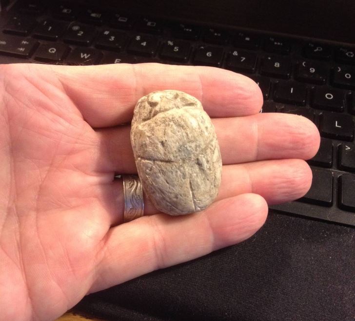 Egypt Amenhotep III stone scarab IN-HAND obv.JPG