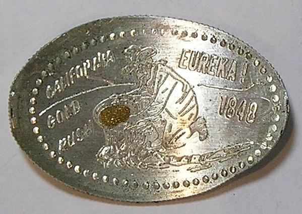 Elongated Kennedy Silver half dollar gold panner with real gold dust in pan.jpg