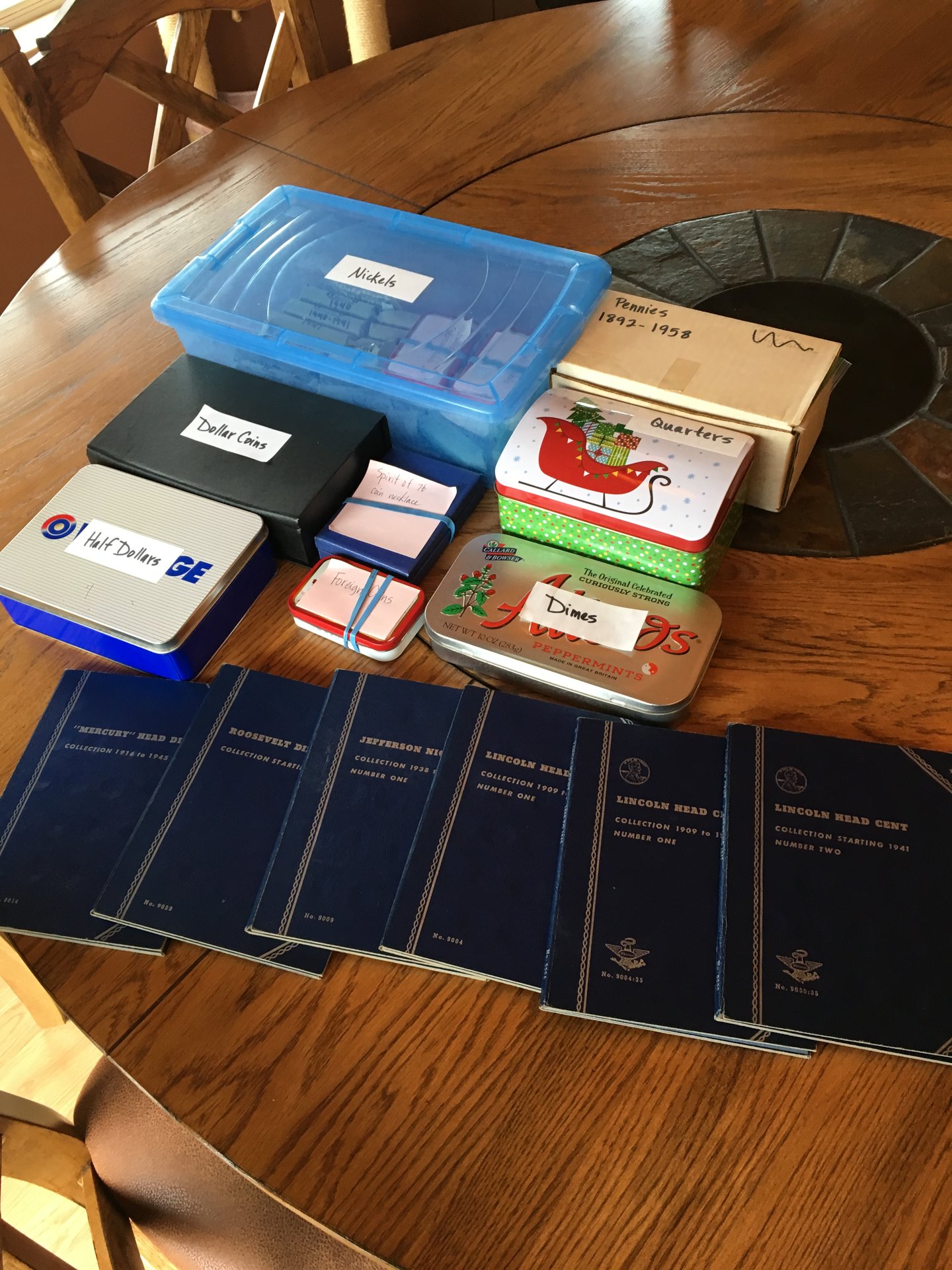 Evan coin collection on the table.JPG