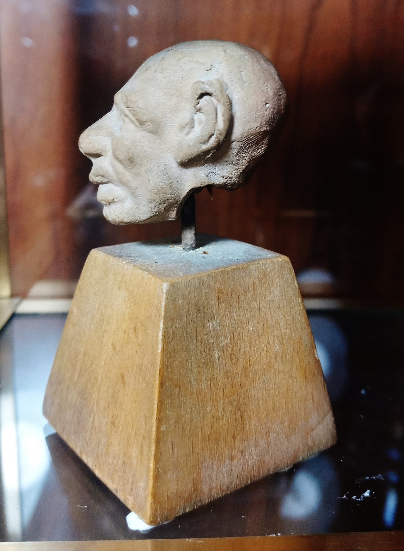Greek terracotta head of comic old man (grotesque), profile left.jpg