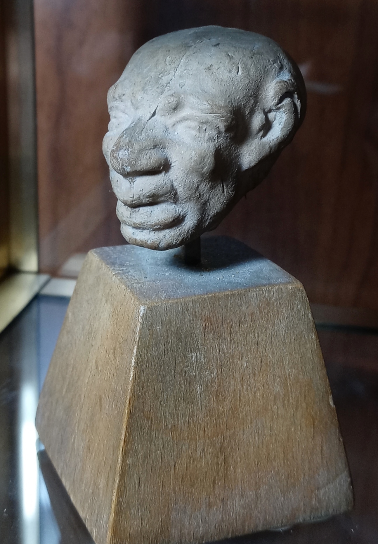 Greek terracotta head of old man (comic grotesque), face forward, three-quarters.jpg
