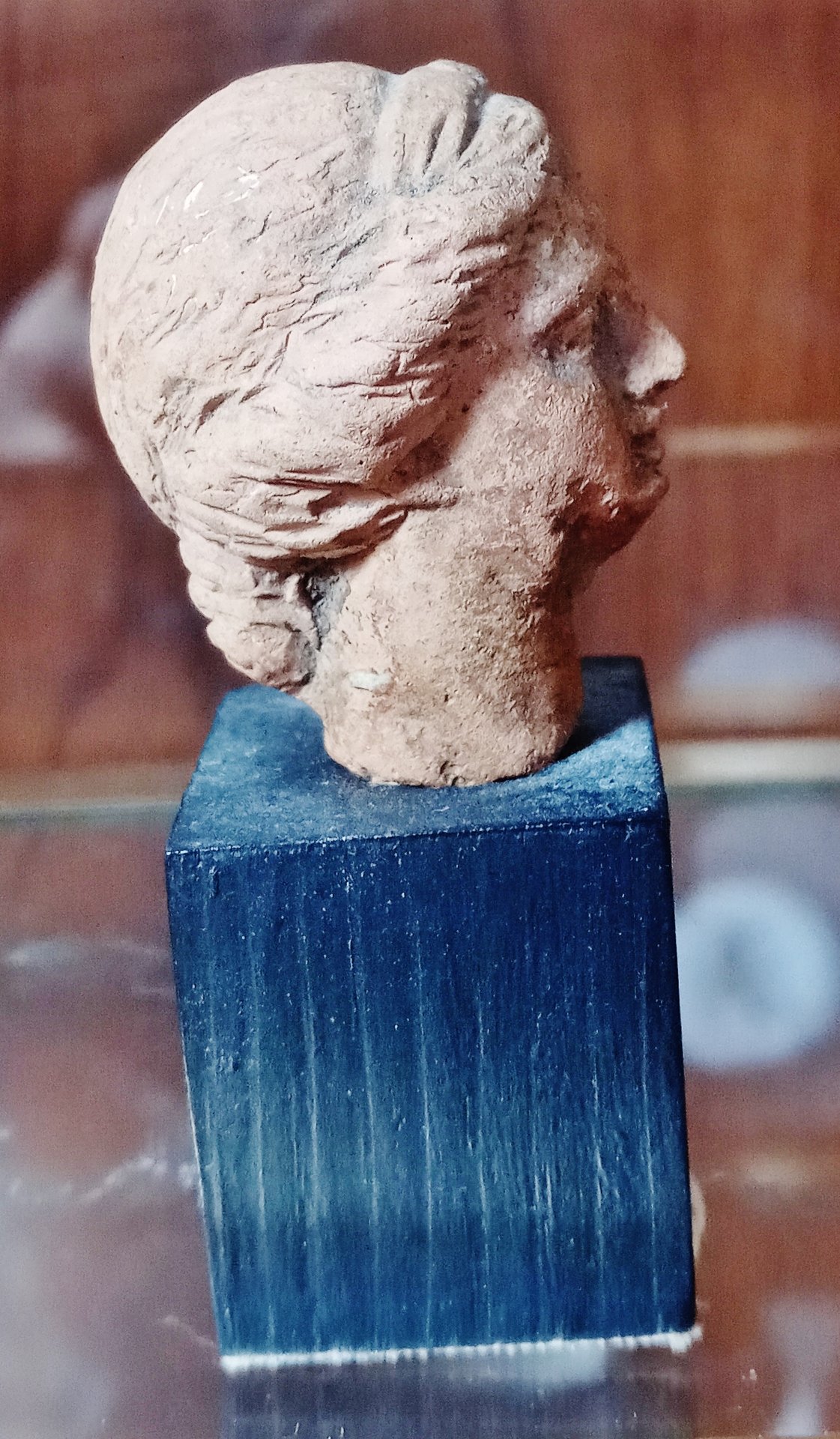 Greek Terracotta Tanagra head, female, right profile.jpg