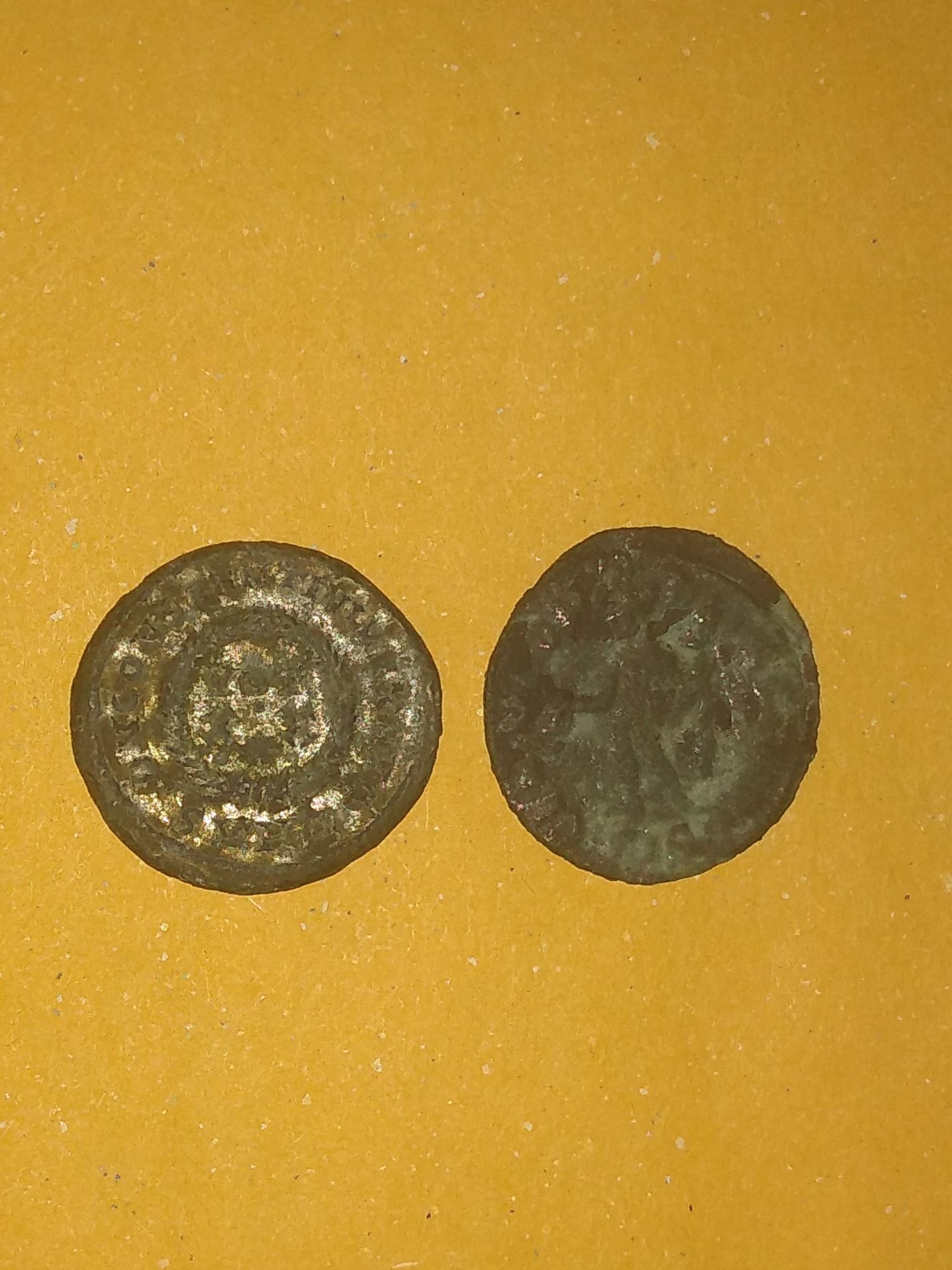 What is my best tool to go about cleaning this $3 Balkan coin from Noble  Roman Coins? It seems to hold a fair amount of detail and I don't want to  mess