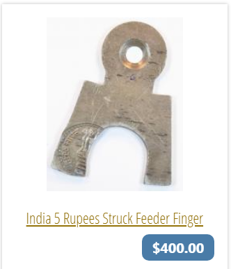 Indian rupee struck on feeder finger.png