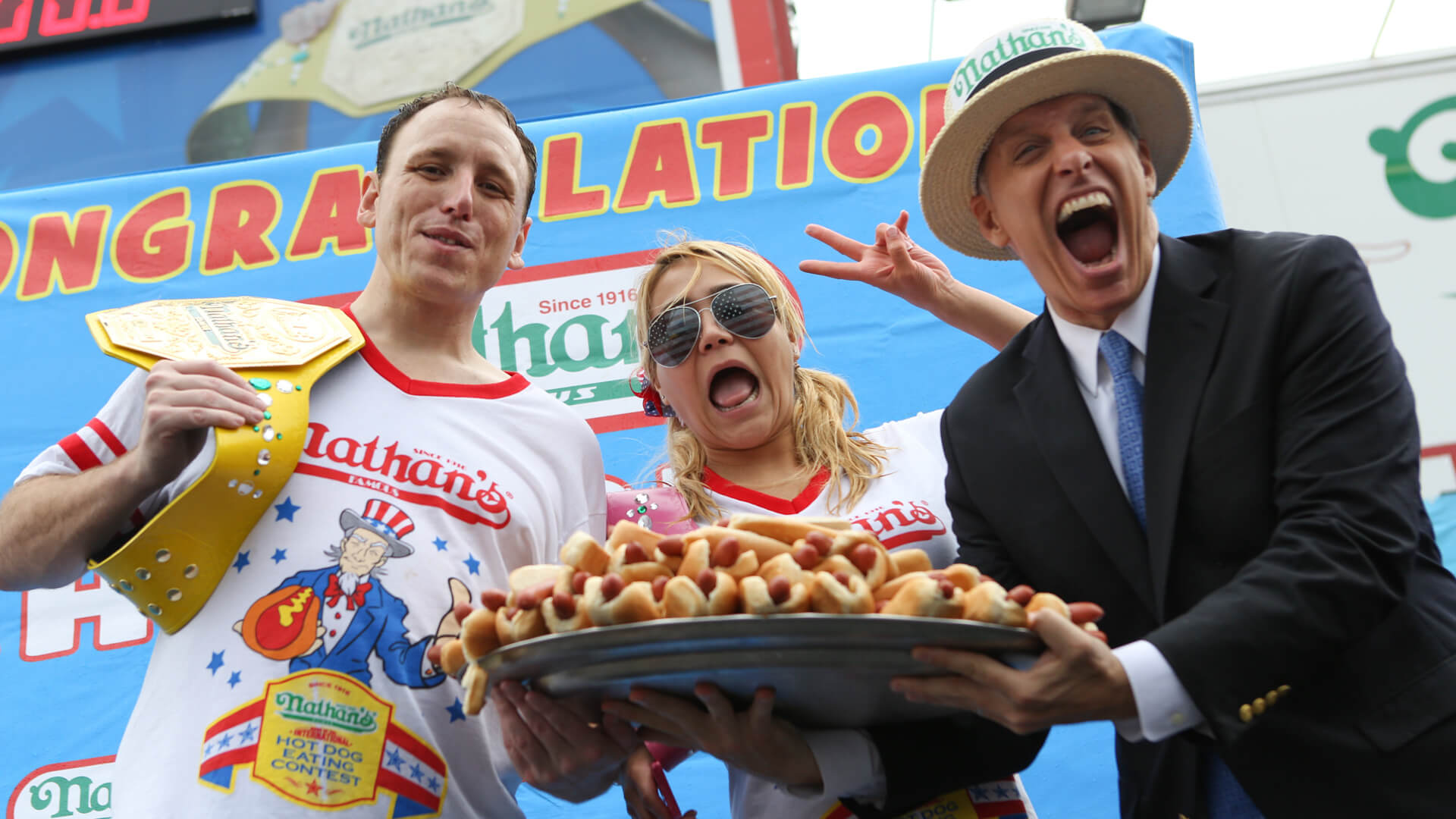 Joey-Chestnut-Miki-Sudo-George-Shea-Nathans-Hot-Dog-shutterstock_editorial_3890886af_huge.jpg