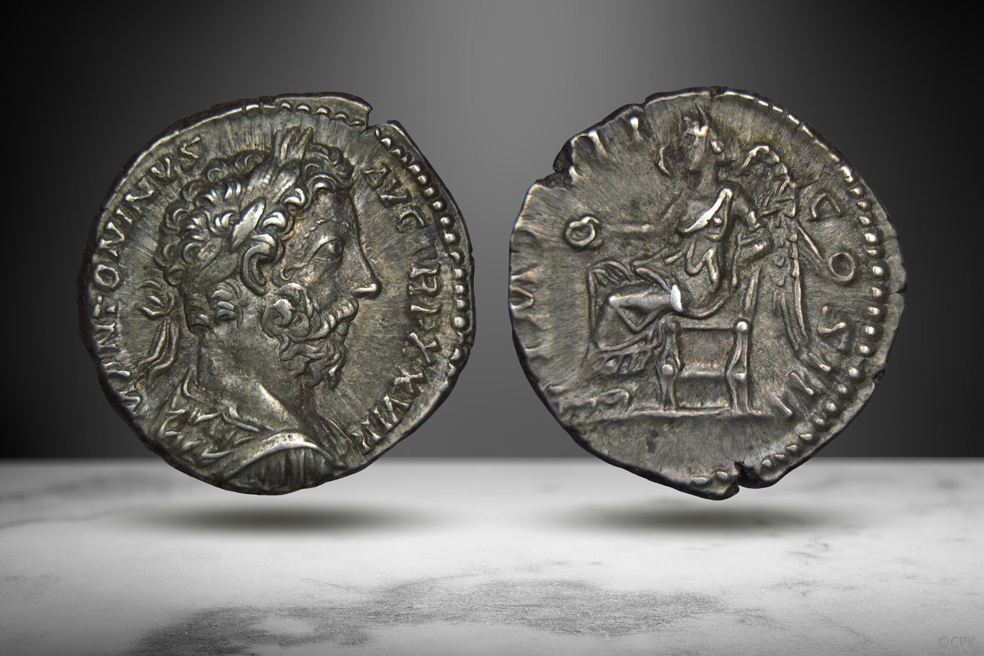 Marcus Aurelius denarius seated Victory.jpg
