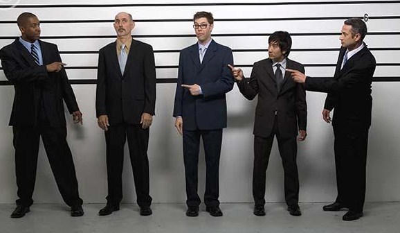 multi-ethnic_businessmen_in_police_line_up_bld039697.jpg