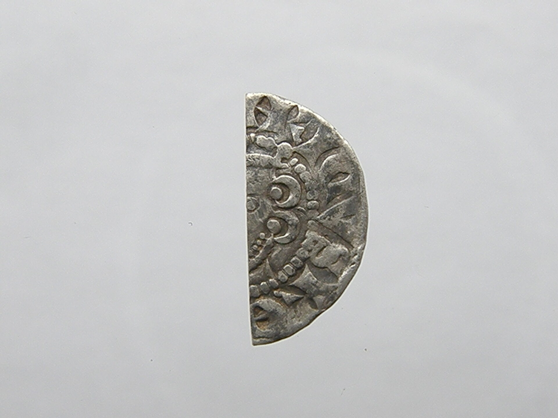 obverse voided long cross cut penny.JPG
