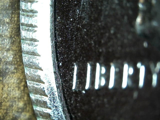 SIDE OF COIN FRONT SILVER.jpg