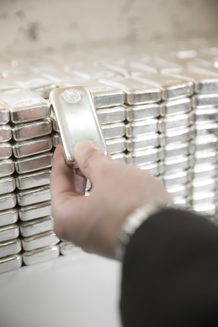 Silver cast bar in hand.jpg