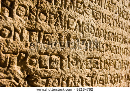 stock-photo-ancient-greek-writing-chiseled-on-stone-92164762.jpg