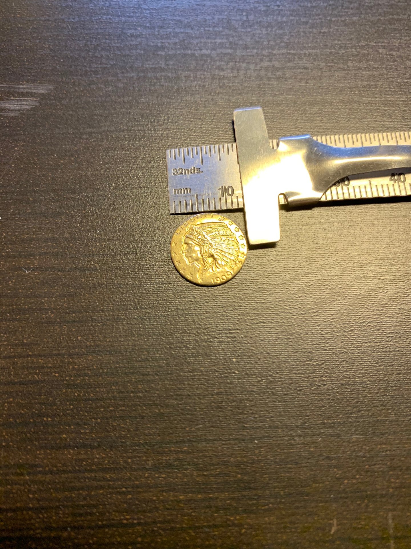 tiny gold indian coin.jpg