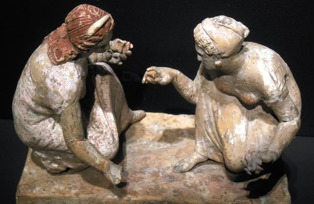 two girls in a game of knucklebones.jpg