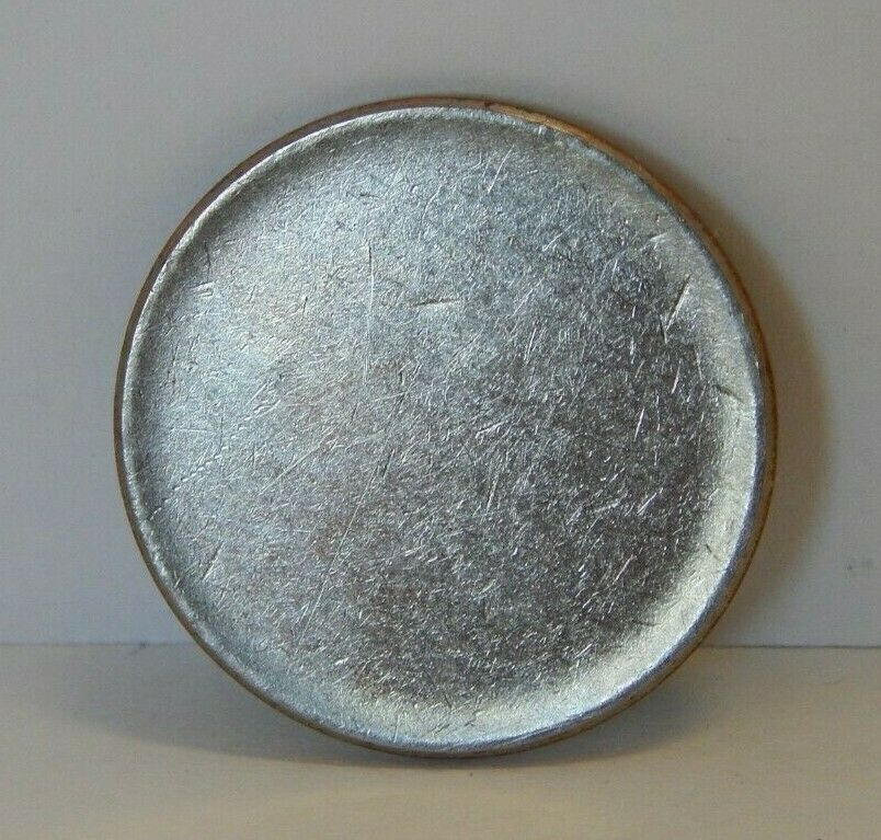 unstruck quarter planchet.jpg