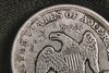 1873-S_Liberty_Seated_Dollar_Obverse_Eagle_Detail-squashed.jpeg