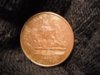 Reverse -- difficulty with lighting -- coin darker brown than image.jpg