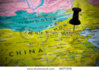 stock-photo-small-pin-pointing-on-beijing-china-in-a-map-asia-18377278.jpg