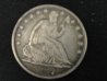 1877over 6 sitting liberty half.jpg