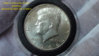 1964D Raised Sunken Die Craters Kennedy Silver Obverse.jpg